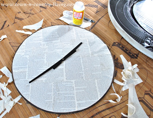 Using book pages to refinish face of big clock